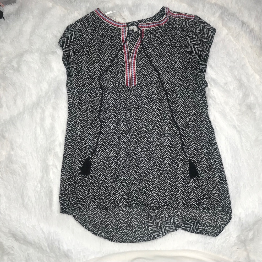 Black top with multicolored detail.